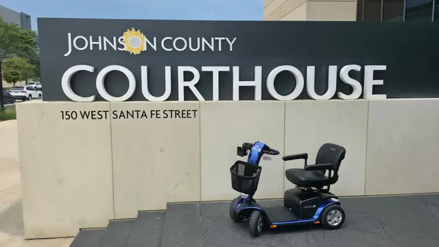 Mobility scooter at the Johnson County Courthouse sign, Olathe