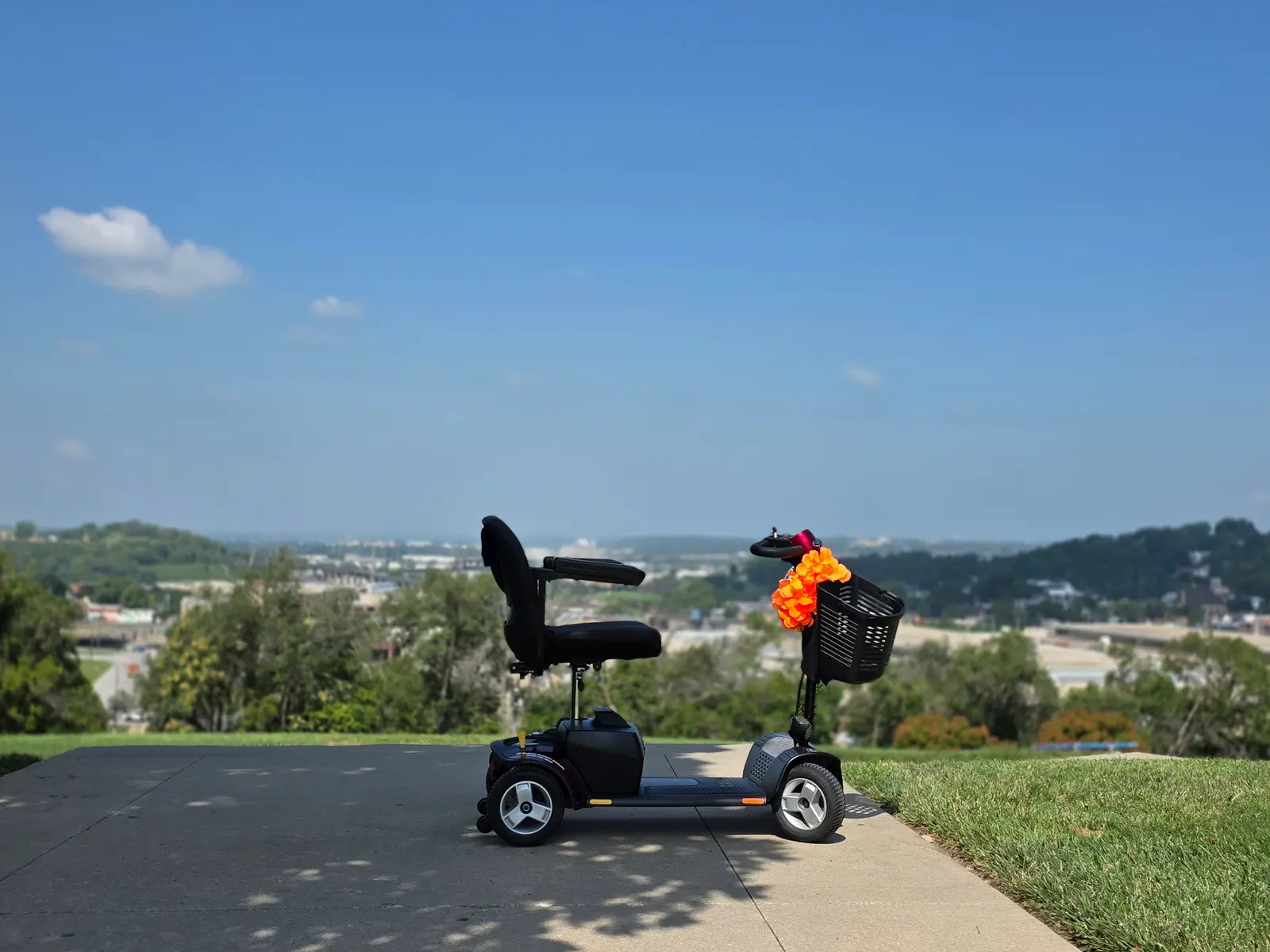 Mobility scooter rental at the Liberty Memorial overlook above the Kansas City skyline