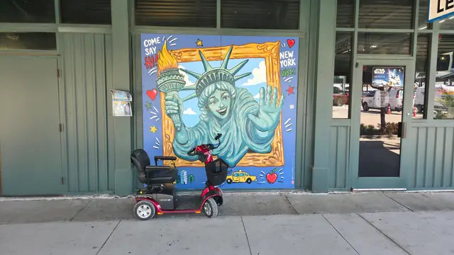 Mobility scooter at Statue of Liberty mural, Kansas City