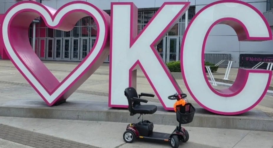 Pride mobility scooter staged at the I♥KC sign in front of T-Mobile Center in downtown Kansas City